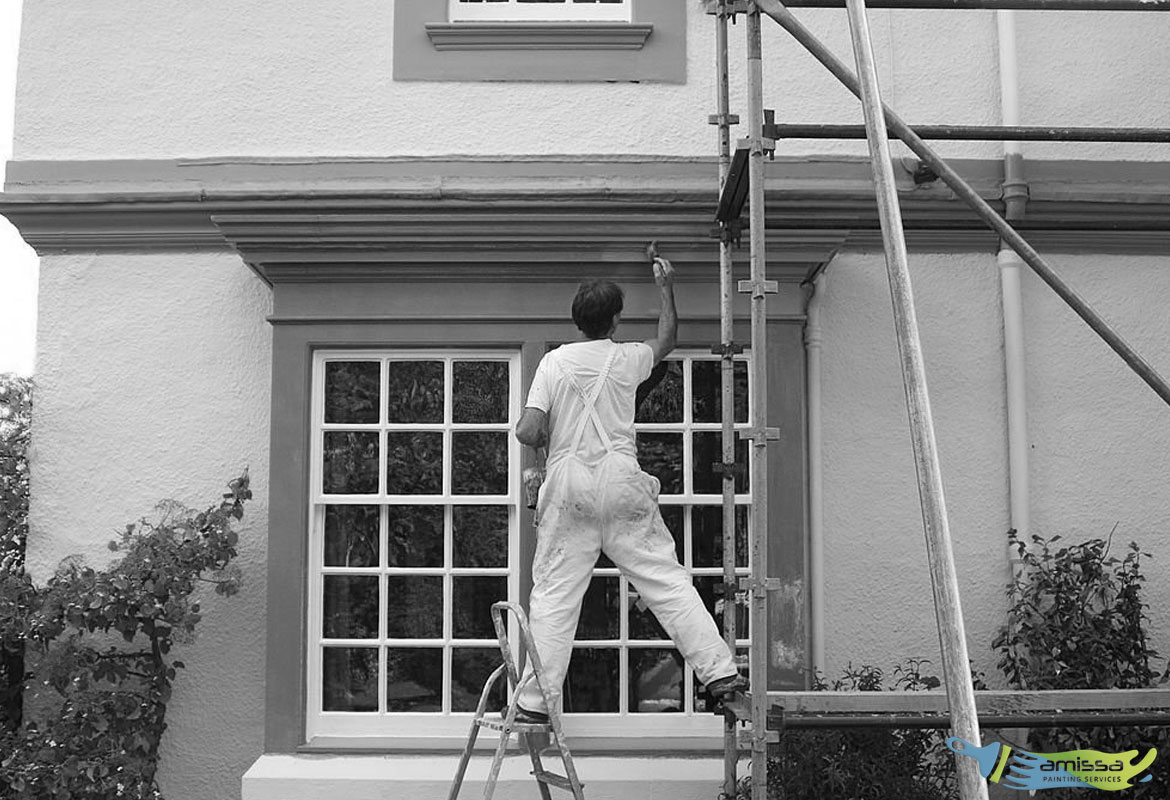 Man Painting House Exterior